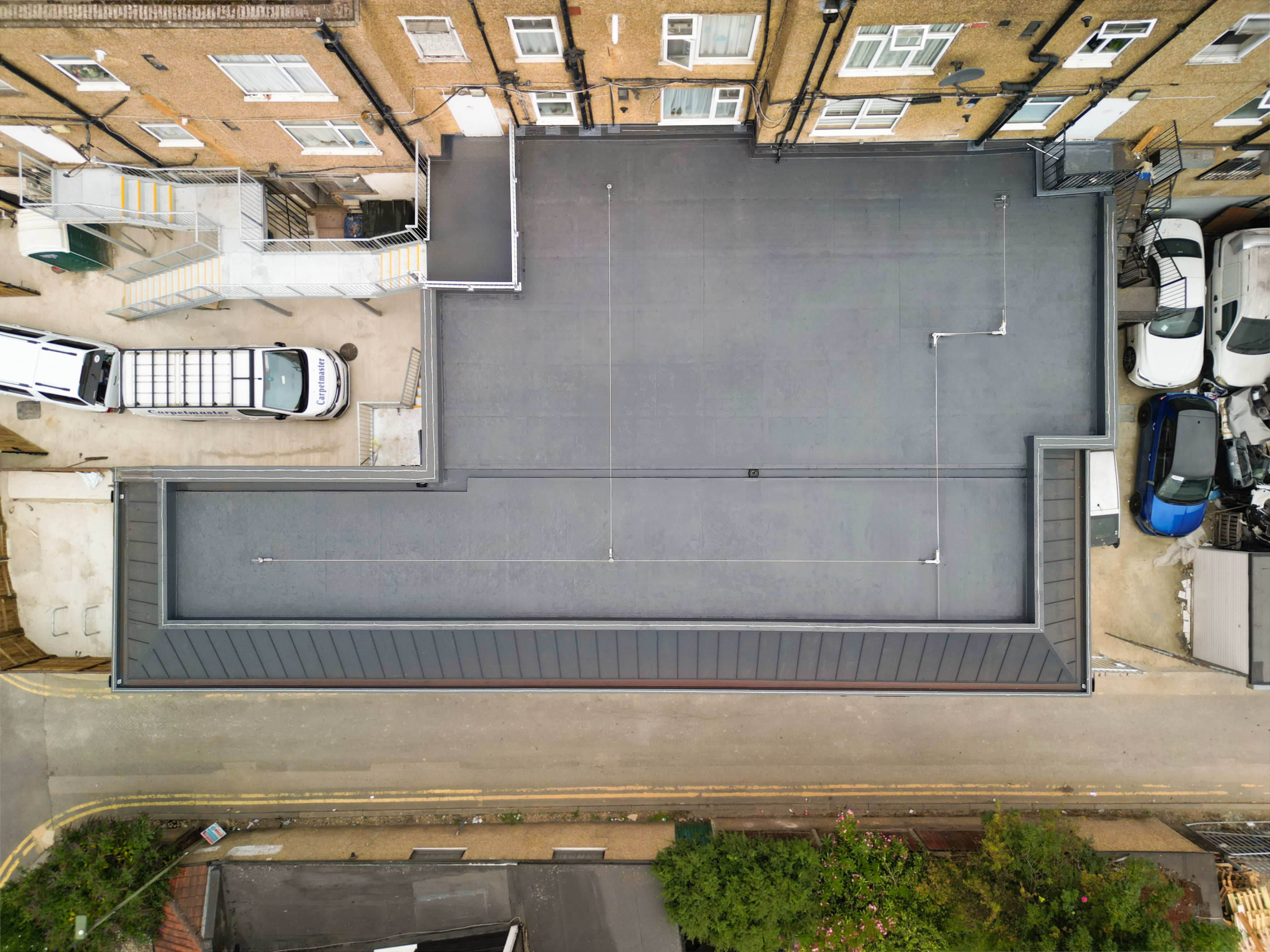Bauder Refurbishment & Parapet Outlet Leaf Guards – change in appearance