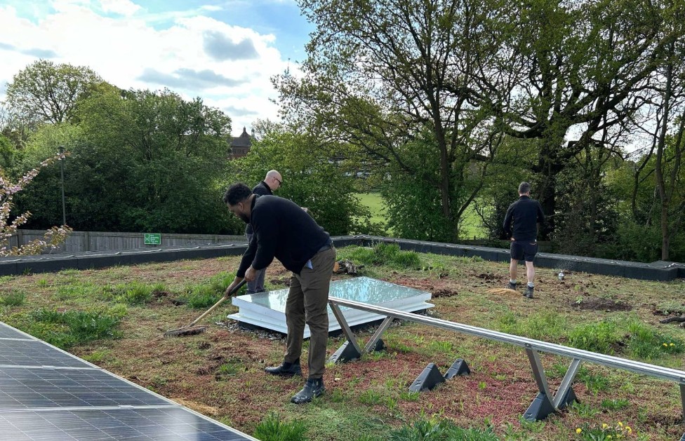 Bauder area technical managers attend to the award-winning biosolar roof during a grounds maintenance day at Noah’s Ark Children’s Hospice in Barnet, North London.